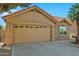 Tan two-story house with a two-car garage and desert landscaping at 8947 E Mescal St, Scottsdale, AZ 85260