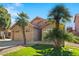 Two-story house with palm trees and a well-maintained lawn at 8947 E Mescal St, Scottsdale, AZ 85260