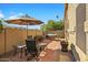 Brick patio with umbrella, seating, and a hammock at 8947 E Mescal St, Scottsdale, AZ 85260