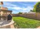 Backyard features a grassy area and pergola at 906 N Swan Dr, Gilbert, AZ 85234