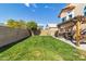 Spacious backyard with a pergola, grass, and patio at 906 N Swan Dr, Gilbert, AZ 85234