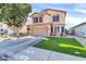 Two-story house with artificial turf and a two-car garage at 906 N Swan Dr, Gilbert, AZ 85234