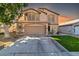 Two-story house with a landscaped lawn and a two-car garage at 906 N Swan Dr, Gilbert, AZ 85234