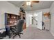 Home office features built-in shelving and a large desk at 906 N Swan Dr, Gilbert, AZ 85234