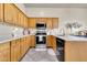 Kitchen with wood cabinets and granite countertops at 906 N Swan Dr, Gilbert, AZ 85234