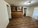 Dining area with wood hutch and laminate floors at 914 N 40Th Ave, Phoenix, AZ 85009