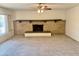 Living room with fireplace and ceiling fan at 914 N 40Th Ave, Phoenix, AZ 85009