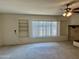 Living room with built-in shelving and window at 914 N 40Th Ave, Phoenix, AZ 85009