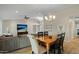 Dining area with wooden table and built-in wet bar at 9230 N 104Th Pl, Scottsdale, AZ 85258