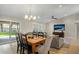 Dining area with wooden table and view of backyard at 9230 N 104Th Pl, Scottsdale, AZ 85258