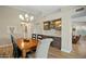 Dining area with wooden table and built-in wet bar at 9230 N 104Th Pl, Scottsdale, AZ 85258