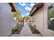 Pathway leading to the house with wrought iron gate at 9230 N 104Th Pl, Scottsdale, AZ 85258