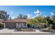 Single-story home with terracotta tile roof and desert landscaping at 9230 N 104Th Pl, Scottsdale, AZ 85258