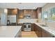 Modern kitchen with stainless steel appliances and quartz countertops at 9230 N 104Th Pl, Scottsdale, AZ 85258