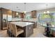 Modern kitchen with stainless steel appliances and a large island at 9230 N 104Th Pl, Scottsdale, AZ 85258