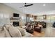 Living room with fireplace and comfortable seating at 9230 N 104Th Pl, Scottsdale, AZ 85258