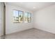 A bright bedroom with natural light and tile flooring at 9350 E Sequence Ave, Mesa, AZ 85212