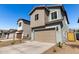 Two-story home with a two-car garage and low-maintenance landscaping at 9350 E Sequence Ave, Mesa, AZ 85212