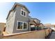 Two-story home with a stucco exterior, a brown roof, white framed windows, and a small yard at 9350 E Sequence Ave, Mesa, AZ 85212