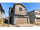 Shot of two-story home featuring attached two-car garage and desert landscaping at 9350 E Sequence Ave, Mesa, AZ 85212