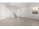 Bright and airy living room features neutral colors and a staircase at 9350 E Sequence Ave, Mesa, AZ 85212