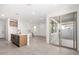 Open floor plan with kitchen island, and stairs leading to second floor at 9350 E Sequence Ave, Mesa, AZ 85212