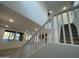 Elegant staircase leading to the upper level of the home at 9350 E Sequence Ave, Mesa, AZ 85212