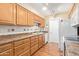 Well-equipped kitchen featuring light wood cabinets at 10429 W Highwood Ln, Sun City, AZ 85373