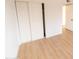 Bright bedroom with light wood floors and sliding closet doors at 14806 N Yerba Buena Way # D, Fountain Hills, AZ 85268