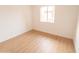 Bright bedroom with light wood floors and a window at 14806 N Yerba Buena Way # D, Fountain Hills, AZ 85268