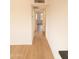 Bright hallway with light wood flooring and access to bedrooms at 14806 N Yerba Buena Way # D, Fountain Hills, AZ 85268