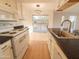 Renovated kitchen with white cabinetry and a view to the patio at 14806 N Yerba Buena Way # D, Fountain Hills, AZ 85268