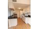 Modern kitchen with white cabinets and dark countertops at 14806 N Yerba Buena Way # D, Fountain Hills, AZ 85268