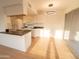 Bright kitchen with breakfast nook, updated cabinets, and wood flooring at 14806 N Yerba Buena Way # D, Fountain Hills, AZ 85268