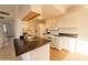 Updated kitchen with white cabinets, granite counters, and stainless steel appliances at 14806 N Yerba Buena Way # D, Fountain Hills, AZ 85268