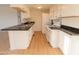 Modern kitchen with white cabinets and granite countertops at 14806 N Yerba Buena Way # D, Fountain Hills, AZ 85268