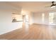 Bright living room with wood-look floors and access to balcony at 14806 N Yerba Buena Way # D, Fountain Hills, AZ 85268