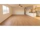Spacious living room featuring light wood floors and kitchen access at 14806 N Yerba Buena Way # D, Fountain Hills, AZ 85268