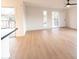 Bright living room with wood-look floors and access to balcony at 14806 N Yerba Buena Way # D, Fountain Hills, AZ 85268