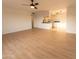 Open living room with light wood floors and kitchen view at 14806 N Yerba Buena Way # D, Fountain Hills, AZ 85268