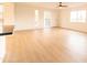 Bright living room with wood-look floors and access to balcony at 14806 N Yerba Buena Way # D, Fountain Hills, AZ 85268