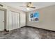 Bedroom with slate floors, window, and built-in closet at 1519 E 7Th Dr, Mesa, AZ 85204