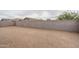 Large backyard with block wall and sandy ground at 16131 W Sand Hls Dr, Surprise, AZ 85387