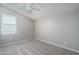 Simple bedroom with ceiling fan and window shutters at 16131 W San Hill Rd, Surprise, AZ 85387