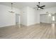 Dining room with chandelier and laminate wood flooring at 16210 N Desert Holly Dr, Sun City, AZ 85351