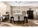 Bright dining room features a large table, chandelier, and fireplace at 18193 W Buckhorn Dr, Goodyear, AZ 85338