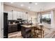 Modern kitchen with two-toned cabinetry, granite island, and stainless steel appliances at 18193 W Buckhorn Dr, Goodyear, AZ 85338