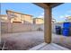 Small, compact backyard with block wall and small plant at 18536 W Douglas Way, Surprise, AZ 85374