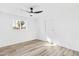 Bedroom with ceiling fan, sliding doors, and wood-look floors at 1890 E Palmcroft Dr, Tempe, AZ 85282