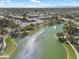 Aerial view of a picturesque community with lush landscaping, winding lakes, and a central fountain at 1923 E Drake Dr, Tempe, AZ 85283